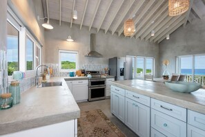 Villa | Private kitchen | Full-size fridge, microwave, oven, stovetop - Paradise Cove: Oceanfront Haven With Infinity Pool (Gregory Town)