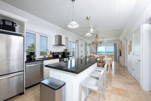 Villa | Private kitchen | Paper towels, dining tables - Oceanfront Bliss: Newly Built Luxury Home With Sunset Views (North Palmetto Point)
