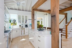 Villa | Private kitchen | Full-sized fridge, microwave, oven, stovetop - Touch Of Class Cottage: Beachfront Oasis (Savannah Sound)