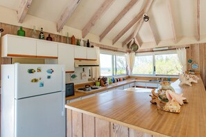 Villa | Private kitchen | Full-size fridge, microwave, oven, stovetop - Island Oasis: Beachfront Retreat With Infinity Pool (Governor's Harbour)