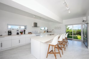 Villa | Private kitchen | Full-sized fridge, microwave, oven, stovetop - Modernized Beach House With Pool (Governor's Harbour)