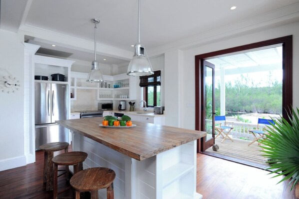 Villa | Private kitchen | Full-size fridge, microwave, oven, stovetop - Beachside Beauty: Brand New Home With Pool (Savannah Sound)