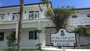 A sign for The Club at Windermere Island. - Coastal Chic: Stylish Condo On Windermere Beach (Governor's Harbour)
