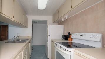 Villa | Private kitchen | Full-sized fridge, microwave, oven, stovetop