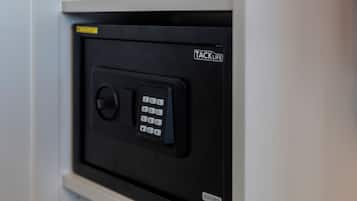 A black safe with a keypad and the brand name "TACKLIFE" visible.