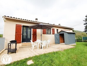 Enjoy a relaxing stay in this charming single-story retreat with a patio area and comfortable seating.
