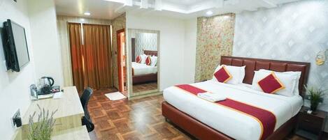 Executive kamer | Een minibar, een bureau, gratis wifi, beddengoed