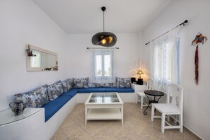 Aloni Cycladic House | Living area | 32-inch flat-screen TV with cable channels - Terra Vecchia Suites (Santorini)