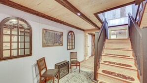 A staircase with wooden steps and a metal railing, leading to a second floor. - Breathtaking Lake Views Walk to Alpine Lake (Terra Alta)