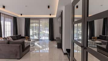 Villa | Living area | 50-inch LED TV with satellite channels, Netflix, heated floors