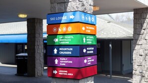 A directional sign with multiple arrows pointing to various facilities including a ski lodge, general store, lift tickets, rentals & lessons, mountain cruisers, family adventure park, and a lessons meeting area. - Resort Amenities, Mountain Views, Sauna! (McGaheysville)