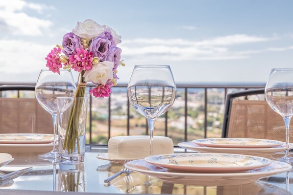 Enjoy a meal with a view from this beautifully set dining table.