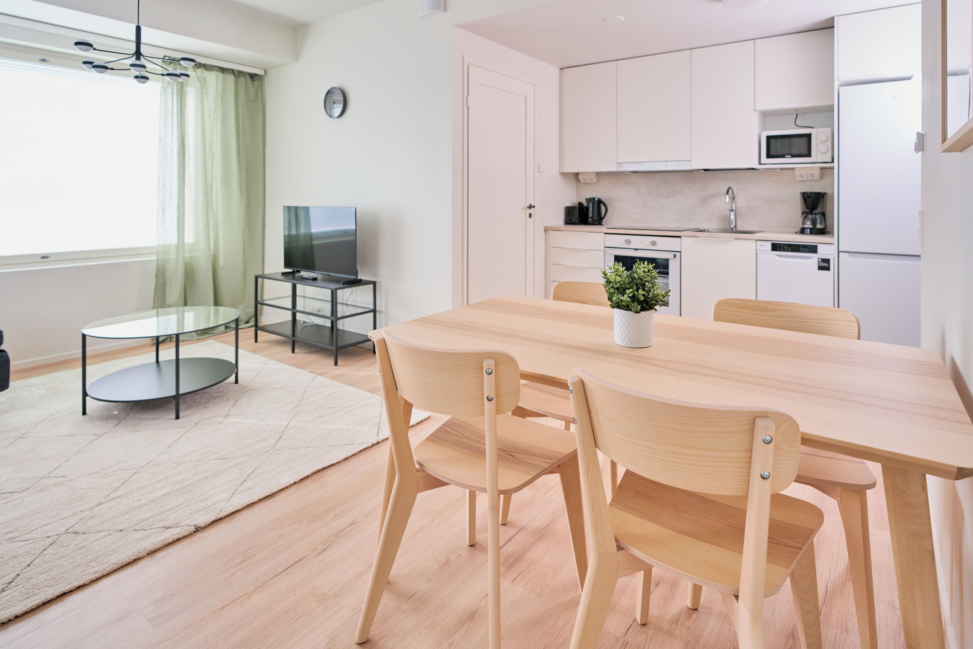 Apartamento Signature | Zona de estar | Una televisión de pantalla plana
