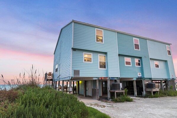 A two-story building with a flat roof and a balcony. - Pet-Friendly Beachfront Condo, Gulf View (Port St. Joe)