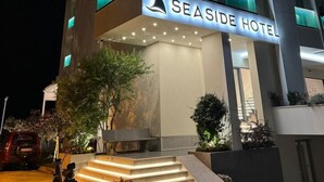 A modern hotel with a prominent sign reading "SEASIDE HOTEL". - Sea Side (Durrës)