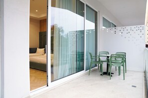 Deluxe Quadruple Room, Balcony, City View | Minibar, in-room safe, desk, soundproofing
