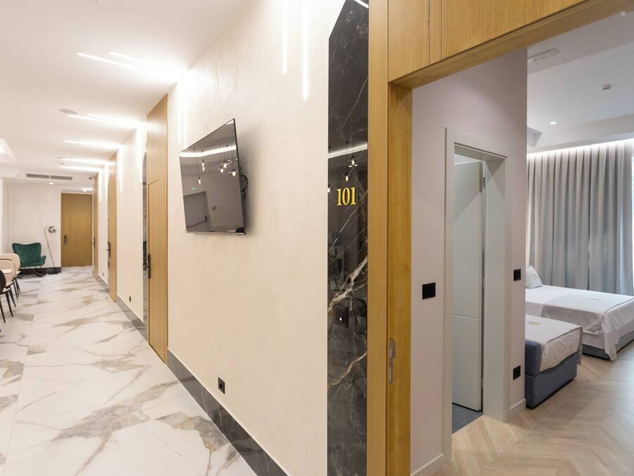 Deluxe Quadruple Room, Balcony, City View | Minibar, in-room safe, desk, soundproofing