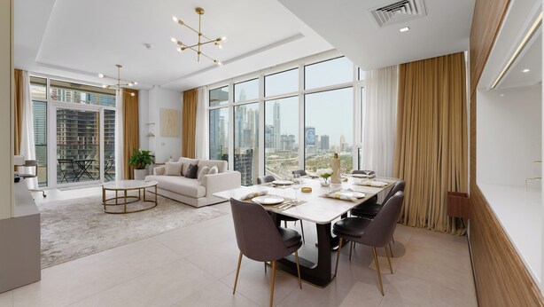 A modern dining area with a large table, chairs, and a city view through large windows. - Maison Privee - Tranquil Apt w/ Mesmerizing Views cls to Marina (Dubai)