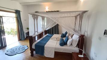 Deluxe Double Room, Balcony, Garden View | In-room safe, desk, laptop workspace, iron/ironing board