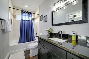 Shower, hair dryer, towels, shampoo