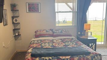 1 bedroom, desk, iron/ironing board, travel crib