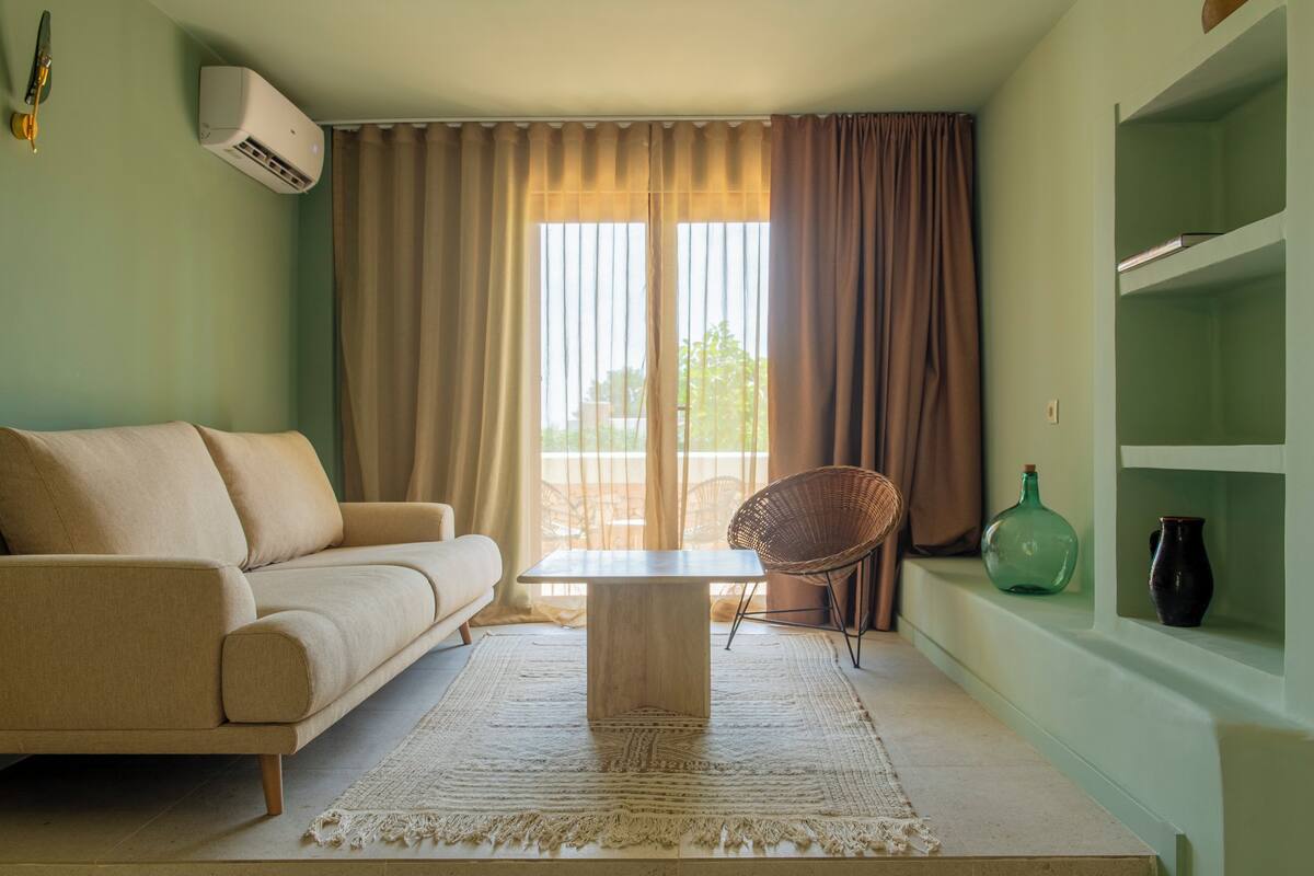 Deluxe Suite, Balcony | Living area | Flat-screen TV
