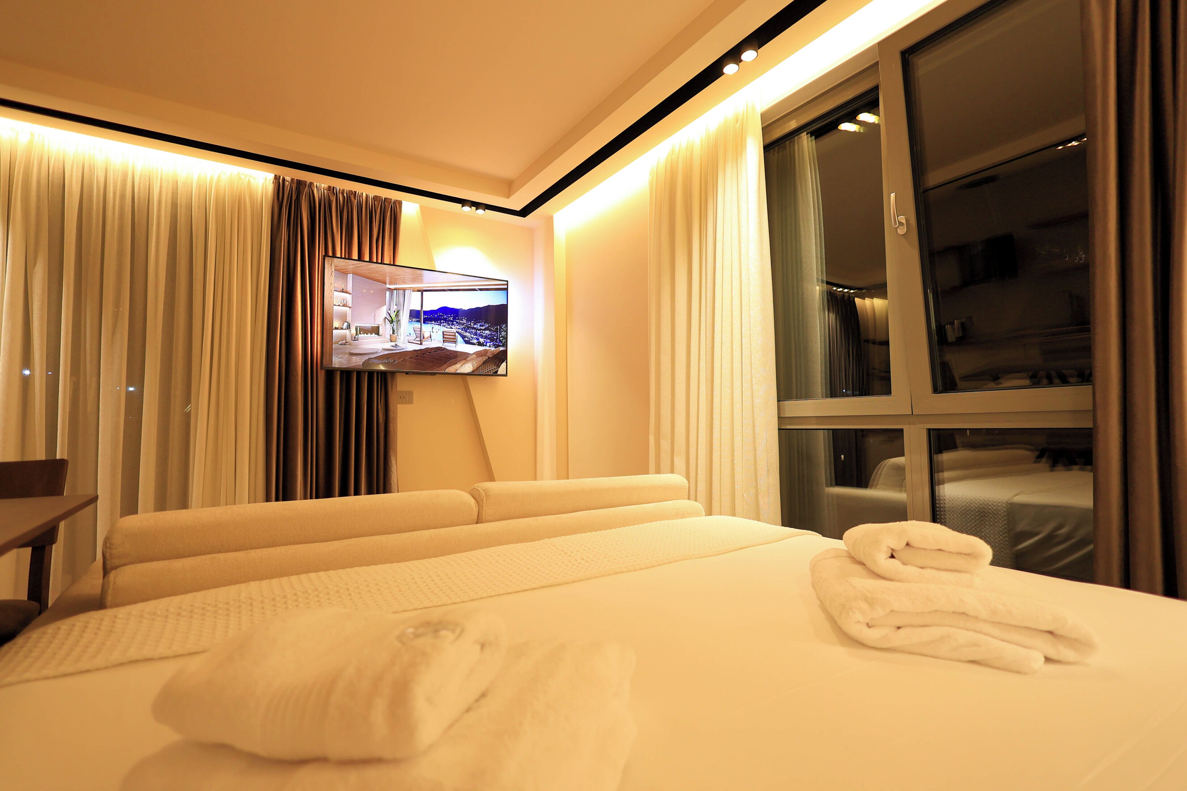 Premium bedding, memory-foam beds, laptop workspace, free WiFi