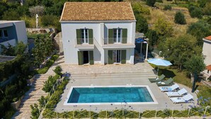 A two-story building with a swimming pool and outdoor seating. - Hedera Estate, Villa Hedera XVIII (Mlini)