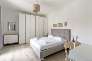 1 bedroom, desk, iron/ironing board, travel crib