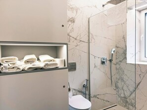 Shower, hair dryer, towels, soap