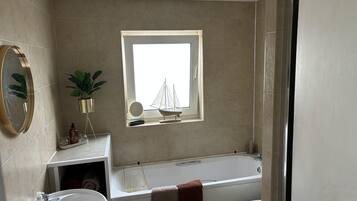 Apartment | Bathroom | Separate bathtub and shower, deep-soaking bathtub, hair dryer, towels