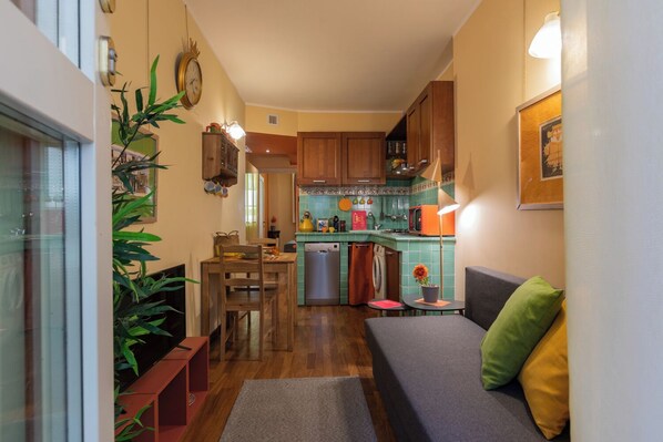 Apartment, Balcony | Living area | 35-inch TV with digital channels