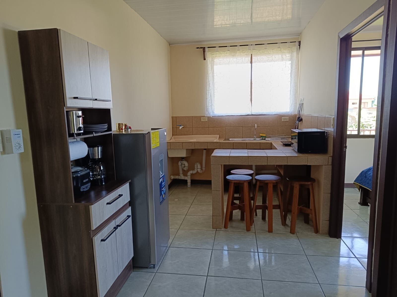 Fridge, microwave, stovetop, coffee/tea maker