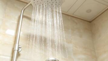 A showerhead with water flowing down.