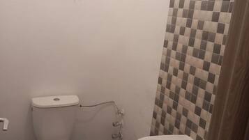 Separate bathtub and shower, deep-soaking bathtub, towels