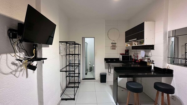 Microwave, stovetop, coffee/tea maker, cookware/dishes/utensils