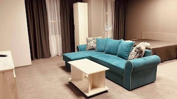 City Studio Suite, 1 Queen Bed with Sofa bed, Non Smoking, Kitchenette | Living area | 80-inch flat-screen TV with satellite channels