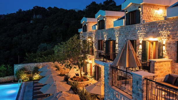 A stone building with outdoor seating and a pool. - Boutique hotel Ruzmarin Garden&SPA (Budva)
