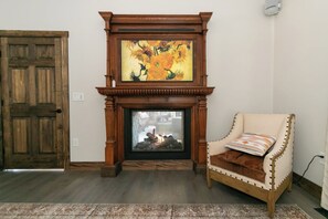 First floor suite fireplace with TV that shows art when off. - Mountain Retreat, 6000 Sq. Feet of Luxury and Fun (Campton)