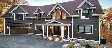 2 car garage with Level 2 EV charger, and ample outside parking.