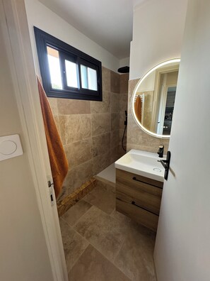 Shower, hair dryer, towels, soap