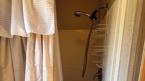 A shower area with a showerhead, a towel rack, and a curtain. - Secluded Nature Escape, Pet Friendly with WiFi in Three Rivers (Three Rivers)