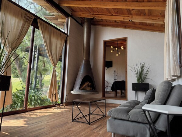 Signature Cabin | Living area | 40-inch flat-screen TV with cable channels, fireplace - Cabañas Santa Fe Tapalpa (Tapalpa)