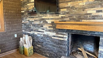 Family Cabin | Living area | 40-inch flat-screen TV with cable channels, fireplace