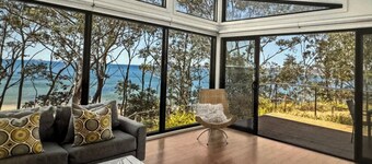 Karana Beach House - a serene coastal haven just a 2-minute walk from the beach.