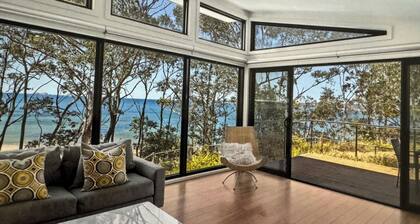 Karana Beach House - a serene coastal haven just a 2-minute walk from the beach.