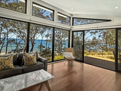 Karana Beach House - a serene coastal haven just a 2-minute walk from the beach.