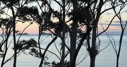 Karana Beach House - a serene coastal haven just a 2-minute walk from the beach.