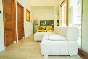 Deluxe Villa, 2 Bedrooms, Private Pool, Garden View | Living room | 42-inch Smart TV with cable channels