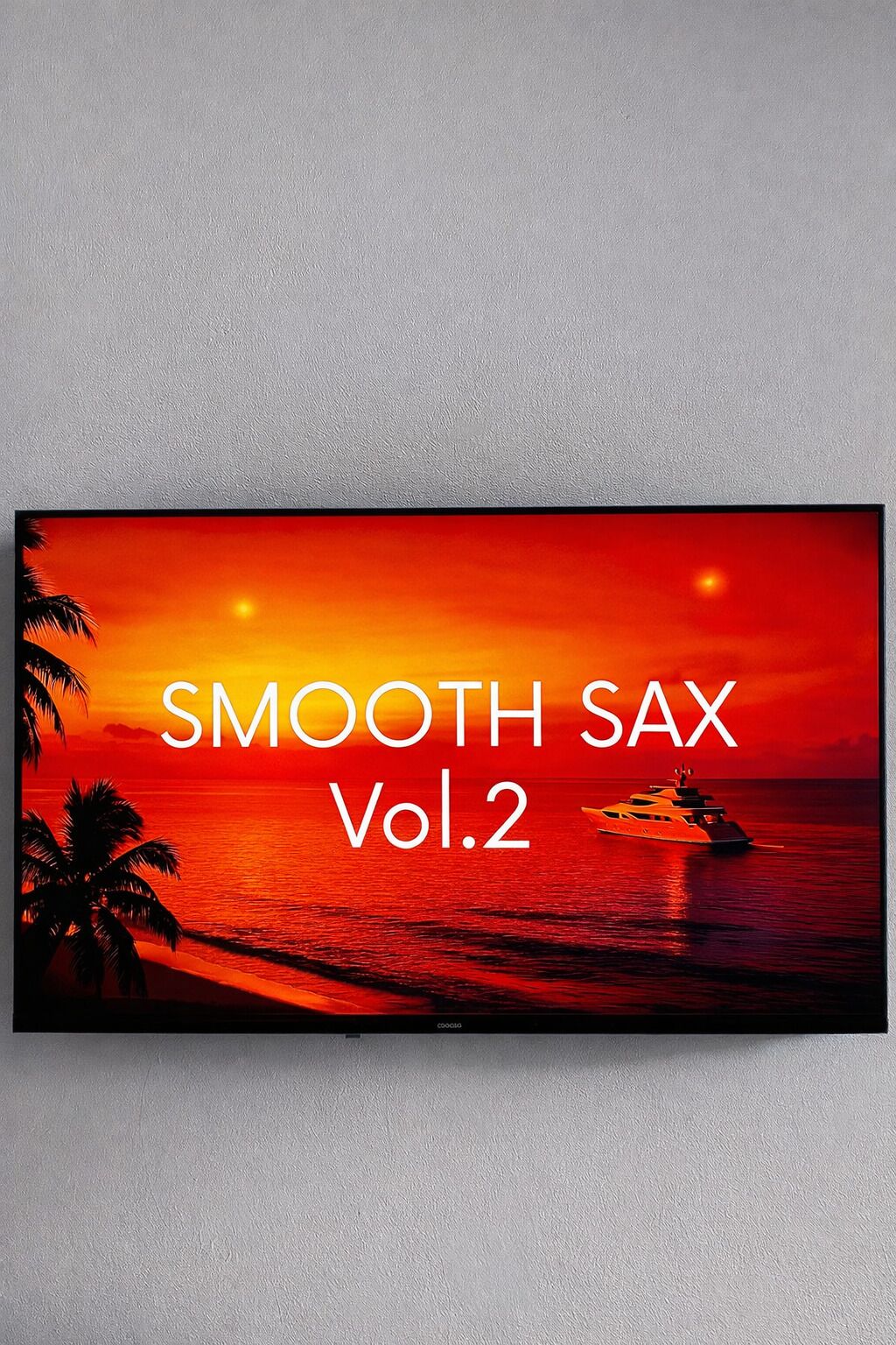 A television displaying a sunset scene with a yacht, palm trees, and the text "SMOOTH SAX Vol.2".